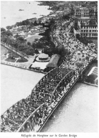 Refugees going over the Garden Bridge to the International Settlement